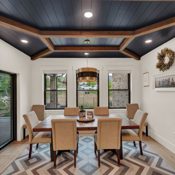 A dining area with a good view of the outdoors.